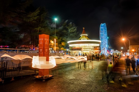 Illuminated CSU truss sock at the Festival at night 