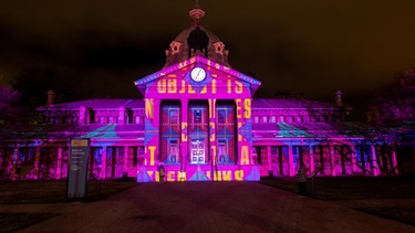 Bathurst Courthouse illuminated with words symbolising connections..